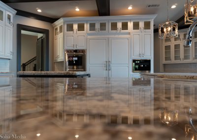 Preissless Design Interior Design - Lake Oconee property - kitchen counters - photography by Solia Media