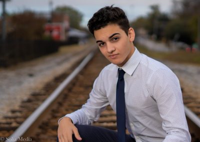 Solia Media - Young Man With White Shirt and Tie Graduation Photo - Posing at Conyers GA Train Tracks Best Photography Conyers, Covington, Rockdale, Monroe, Henry